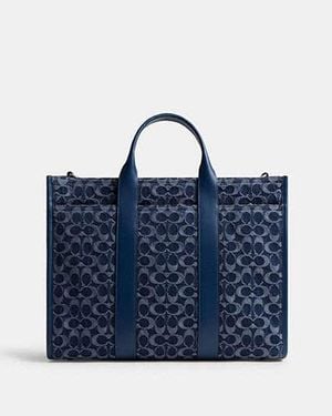 COACH Bolso tote Wesley de tela vaquera de firma - Azul