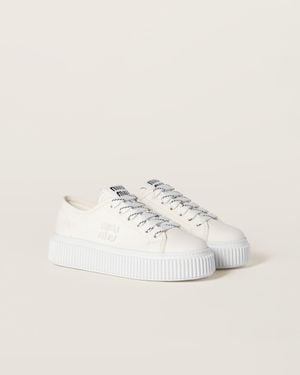 スニーカー MIU MIIU 5T385E_CSL_F0304 WASHED DENIM HIGT TOP SNEAKERS Miu Miu washed-denim Sneakers | Neutrals | FARFETCH
