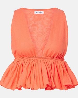 Alaïa Peplum Striped Cotton And Linen Top - Orange