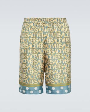 Versace Stylish Silk Bermuda Shorts With All-Over Logo - Yellow