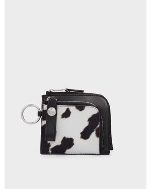 Charles & Keith Pochette Zippée Vega Imprimé Vache Effet Poulain - Noir