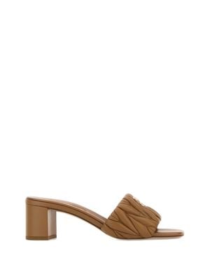 Miu Miu Miu Mini Matelassé Nappa Leather Slide Sandals With-Tone Logo - Brown