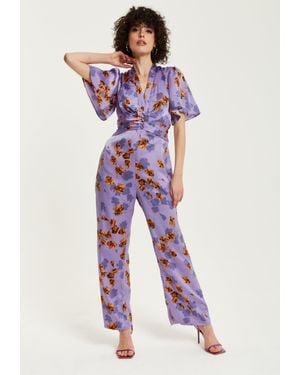 Liquorish Floral Wide Leg Jumpsuit With Angel Sleeves - Purple