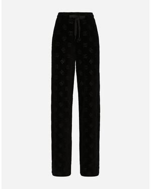 Dolce & Gabbana Flocked Jersey Trousers With All-Over Dg Logo - Black