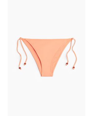 H&M Bas de maillot Tanga à nouer - Rose