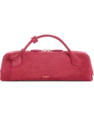 Alaïa Le Teckel Suede East/West Clutch - Pink