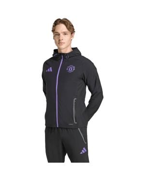 adidas Manchester United 2025/26 Tiro Vis Tech Travel Jacket - Blue