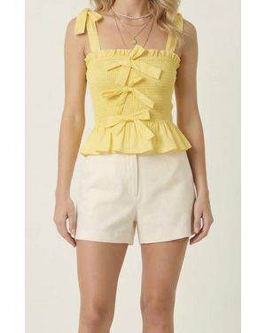 Modenaire Smocked Peplum Top With Bow Tie Straps And Ruffle Hem - Yellow