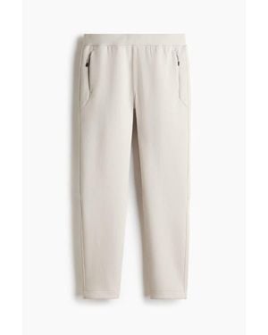 H&M Regular-Fit Tapered Sports Sweatpants With Drymove - White