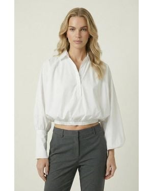 Modenaire Long Sleeve Cropped Elastic Hem Blouse - Natural