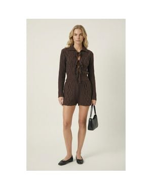 Modenaire Ribbed Knit Romper With Bow Tie Front And Long Sleeves - Black