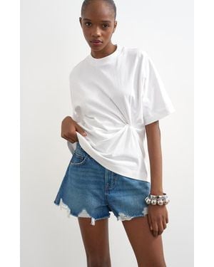 TOPSHOP Distressed Denim Cutoff Shorts - White