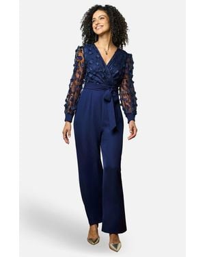 Yumi' Sash Waist Floral Applique Wrap Jumpsuit - Blue
