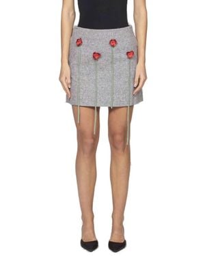 Moschino Mini Skirt With Floral Appliqués And Textured Finish - Black
