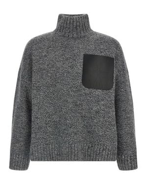 【送料&関税込】J.W. Anderson Black High Neck Sweater With F JW Anderson Leather Patch Pocket Turtleneck Sweater Black