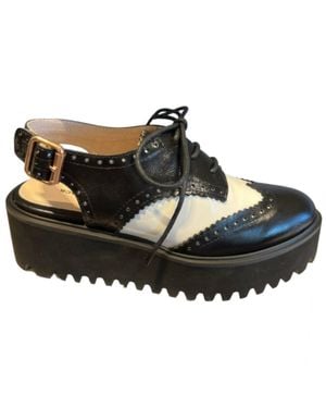 All Black Spectator 23 Mules - Black