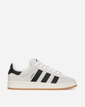 Adidas black trainers white stripes hotsell