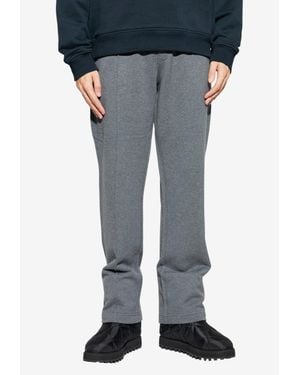 Dolce & Gabbana Shiny Appliqué Track Pants - Blue