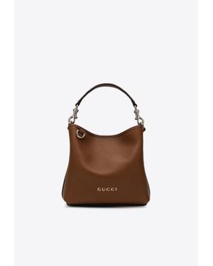 Gucci Mini Gg Embossed Leather Bucket Bag - Brown