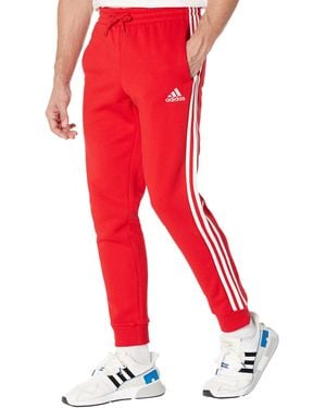 adidas Essentials Fleece Tapered Cuff 3-Streifen Hose - Rot