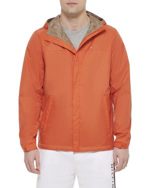 Tommy Hilfiger Chaqueta Ligera y Transpirable con Capucha Impermeable Chubasquero - Naranja