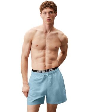 Calvin Klein Uomo Pantaloncino da Bagno Medium Double con Fascia con Logo - Blu