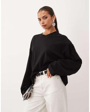Lioness Bloom T-Shirt Met V-Hals, Oversized En Lange Mouwen - Zwart