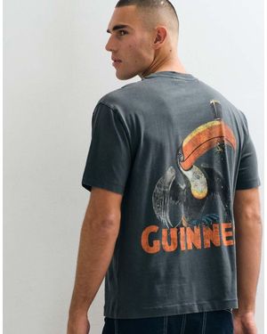 ASOS Ruimvallend T-Shirt Met Christmas Guinness-Print - Blauw