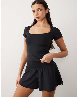 4505 Top Deportivo De Manga Corta Con Cuello Ancho De - Negro