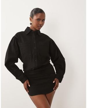 Noughts & Kisses Denim Pocket Front Fitted Skirt Mini Dress - Black