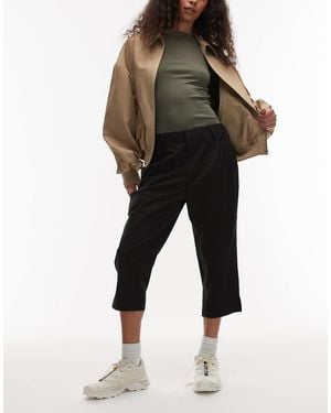Rains Pantalones Capri Negros De Corte Slim Rígido E Impermeable Suva 12530 De