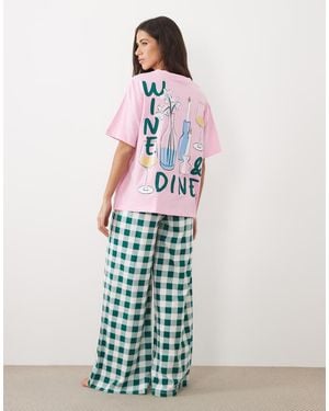 ASOS Oversized Tee And Wide Leg Trouser Pyjama Set With Wine And Dine Graphic - White