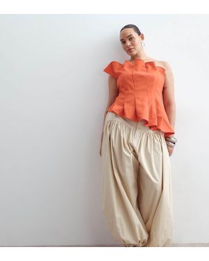 ARRANGE Curve Waist Seam Balloon Leg Trousers - White