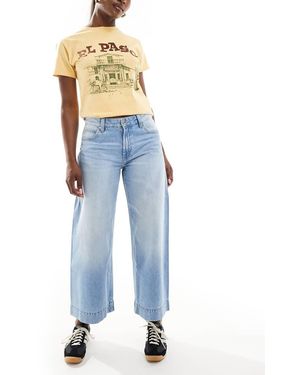 Bershka Jeans A Fondo Ampio Lavaggio Medio Alla Caviglia - Blu