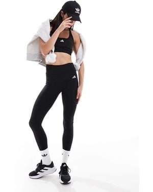 adidas Originals Adidas Training Essentials leggings With Phone Pocket - Blue
