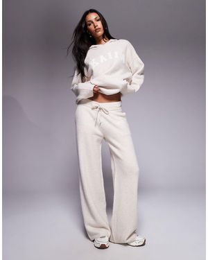 Kaiia Pantalon d'ensemble ample en maille avec broderie logo - grège - Neutre