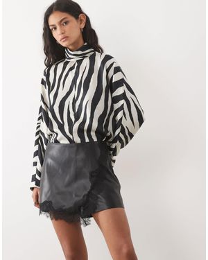 Mango Mini jupe-short avec bordure en dentelle, - Noir
