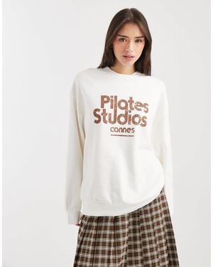ASOS Oversized Sweatshirt With Pilates Studio Graphic - White