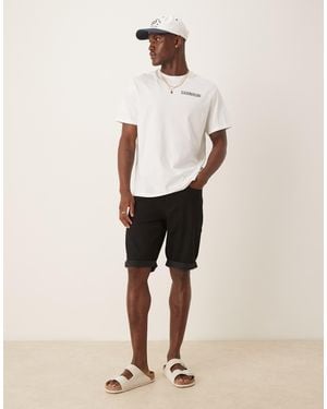 Calvin Klein Short slim en jean avec ourlets à revers - Neutre