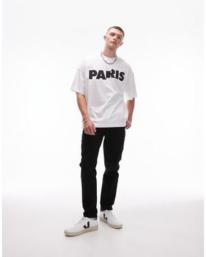 TOPMAN Vaqueros Tapered Negros Elásticos De - Blanco