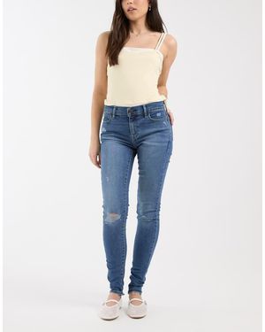 Levi's Vaqueros Azul Oscuro De Corte Superpitillo Con Detalles Rasgados 710 De