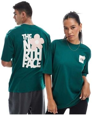 The North Face T-Shirt Oversize Scuro Con Stampa Con Fiore Sul Retro - Verde