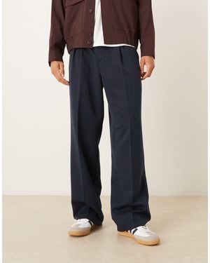 ASOS Pantalon ample habillé à taille élastique et plis inversés - Noir