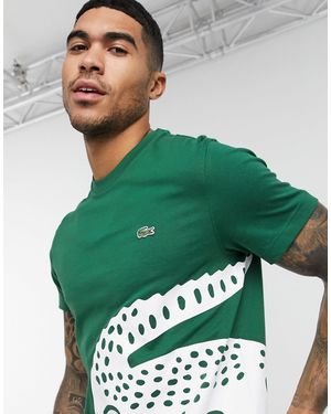 Lacoste – T-Shirt mit großem Krokodilprint - Grün