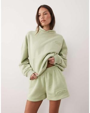 Kaiia Studio Embossed Logo Mini Shorts - Green