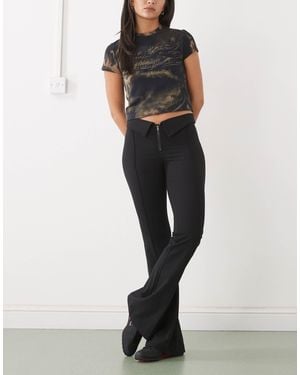 Monki Low Rise Flared Pants With Fold Down Waist Detail - Black