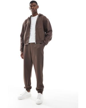 ASOS – essentials – oversize-jogginghose - Braun
