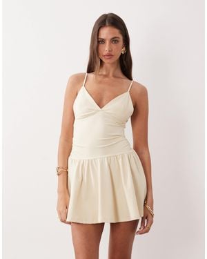 The Frolic Exclusive Slinky Jersey Ruched Side Detail Flippy Hem Mini Dress - Natural