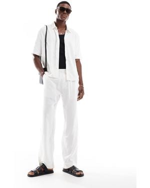 Bershka Pantaloni Bianchi - Bianco