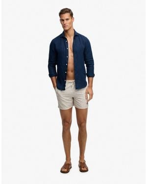 Superdry – premium – badeshorts mit kleinem geometrischem muster - Blau